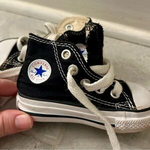 Converse Black Sneakers with High-Top Design and Rubber Toe Cap